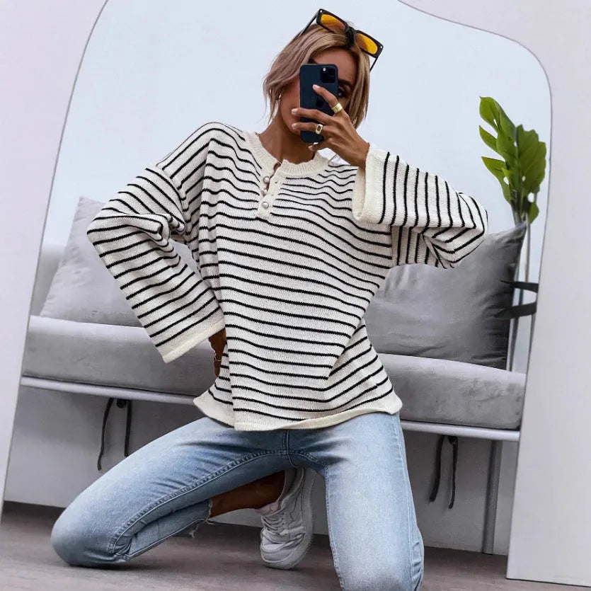 Black striped women's casual top with drop-shoulder sleeves and button detail