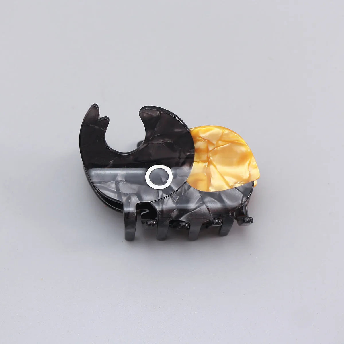 Handmade cellulose acetate beetle grip accessory in green, orange or white insect biology colours