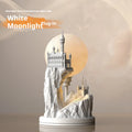 White composite gypsum table lamp with plug and wire switch on a table.