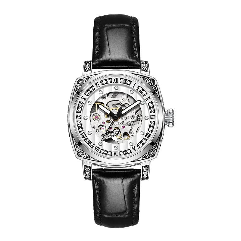 Leather strap mechanical wristwatch with luminous hands on a black dial.