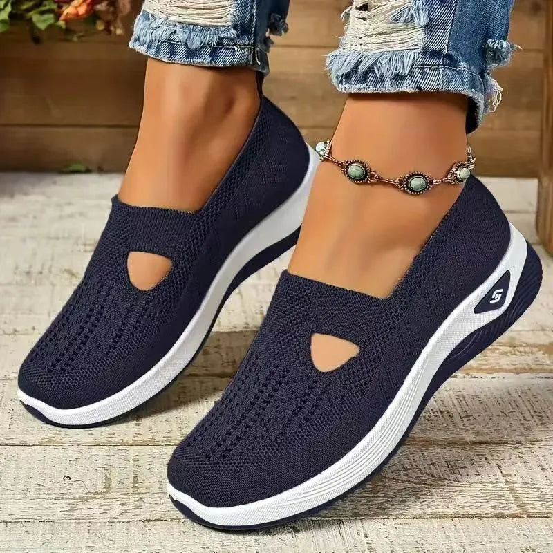 Pair of low top casual mesh shoes with T-strap and soft PVC sole in solid colour for elderly women