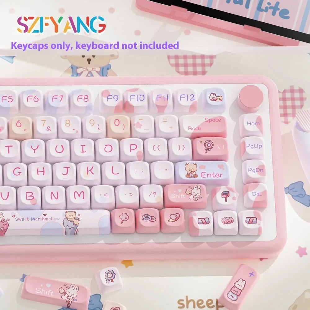 Sweet cotton candy coloured PBT pudding keycaps for mechanical keyboards on a desk