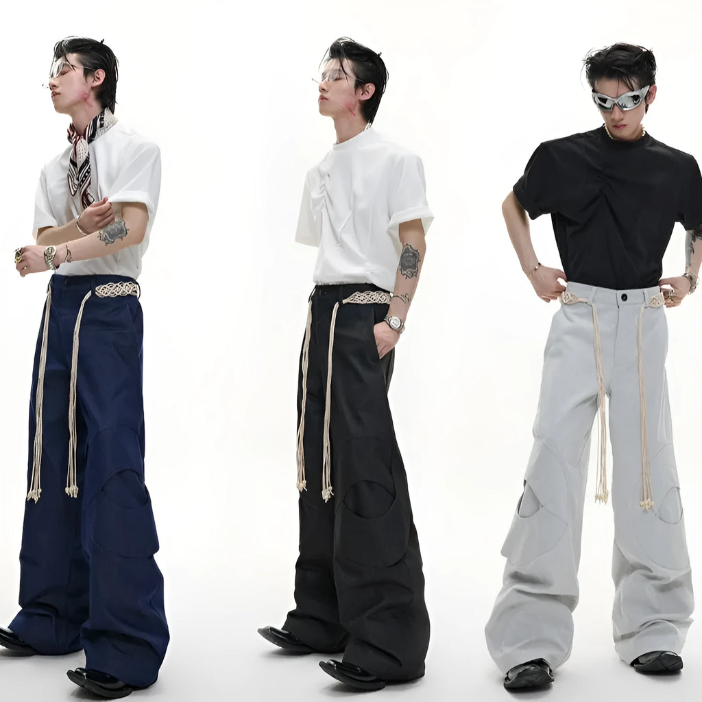 Men's dark blue loose straight-leg jeans with tassel decoration and front zipper placket.