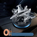 Solar powered rotating fighter-shaped perfume ornament in metallic colour with aluminium alloy base