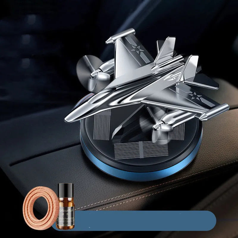 Solar powered rotating fighter-shaped perfume ornament in metallic colour with aluminium alloy base