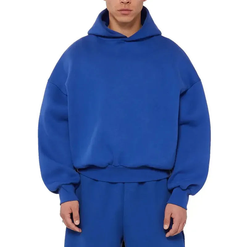 Men's grey fleece-lined cotton pullover hoodie with a wool lining and threaded long sleeves.