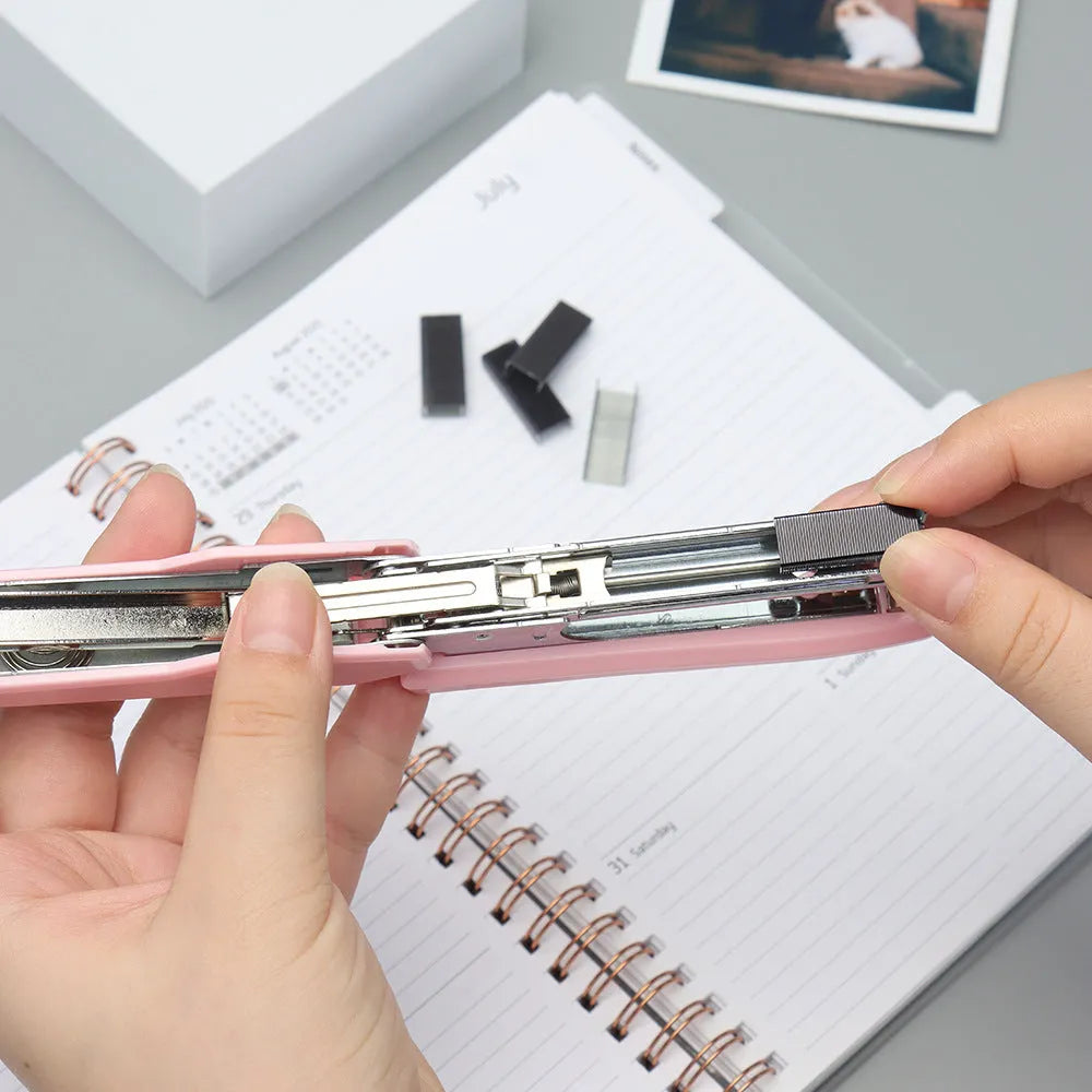 Box of 1000 metal office staples in black, purple, rose gold, and rose red colours