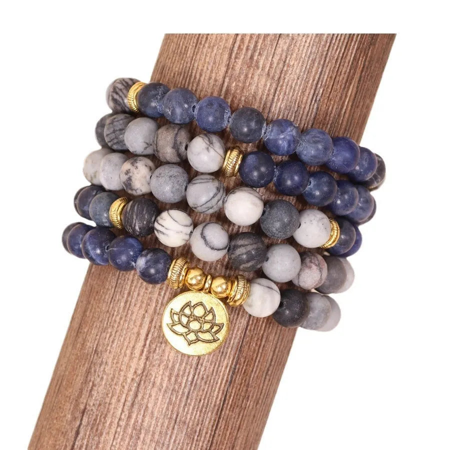 Blue patterned network stone beads on a multi-layer bracelet with an alloy clasp.
