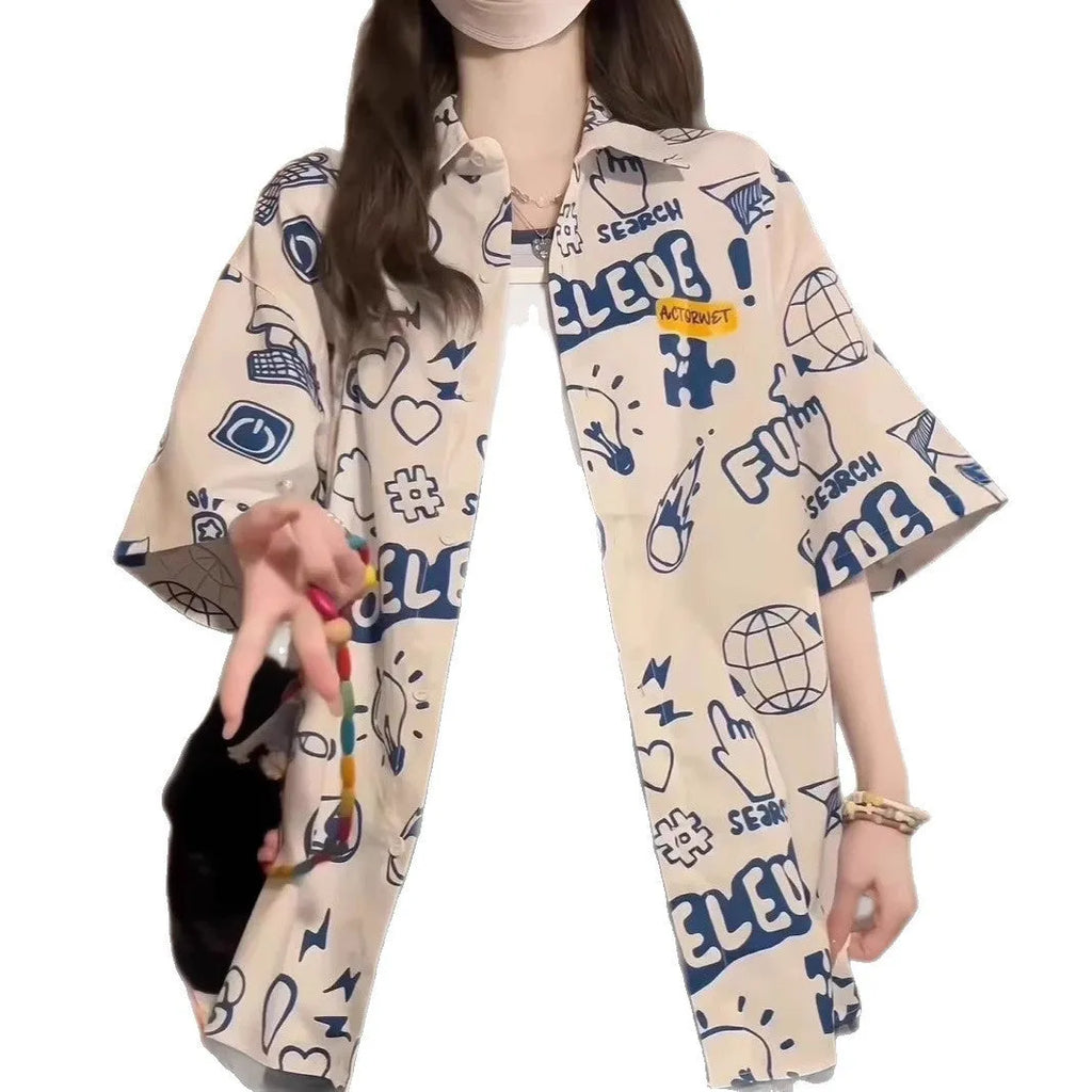 Student loose fit casual shirt with cartoon animation video game graffiti print in white or dark blue, sizes S to 2XL.
