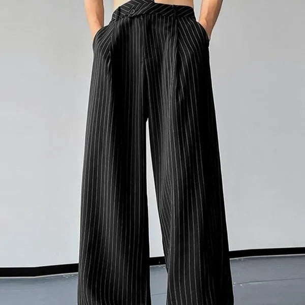 Men's black vertical striped pleated casual trousers with elastic waistband showing front detail