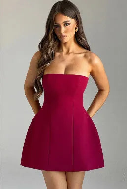 Solid colour backless tube dress with short A-line skirt on a hanger.