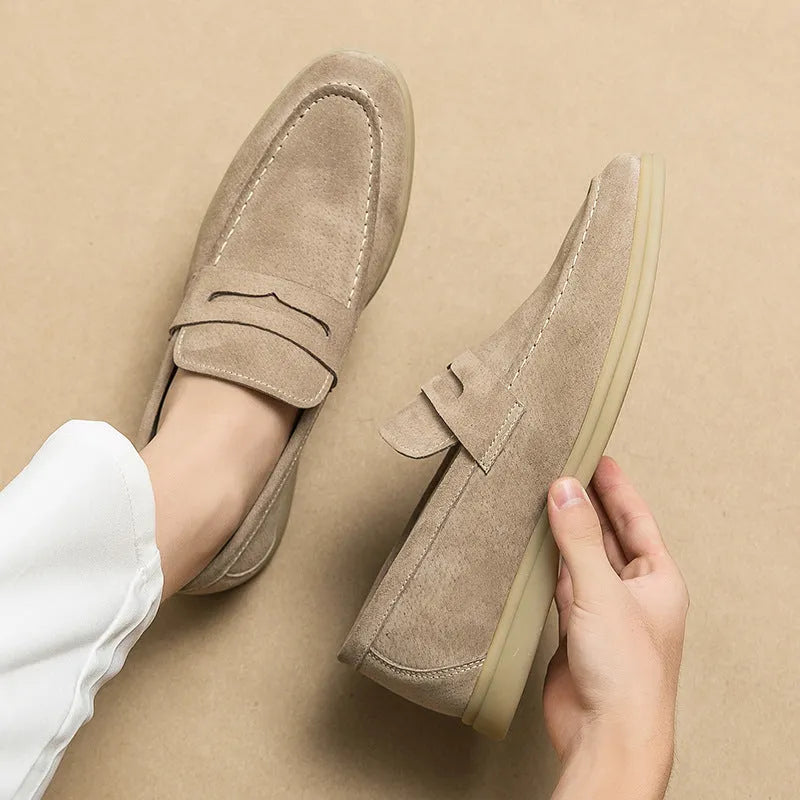 Men's black leather slip-on shoes with round toe and rubber sole on a white background