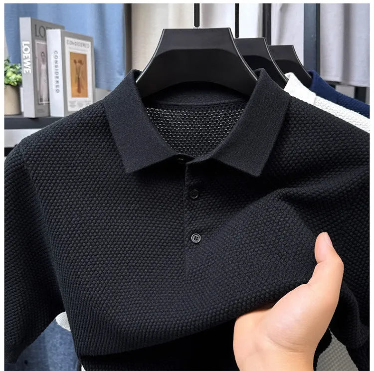 A loose-fitting short sleeve cotton pullover sweater on a hanger, shown in one of the six available colours.