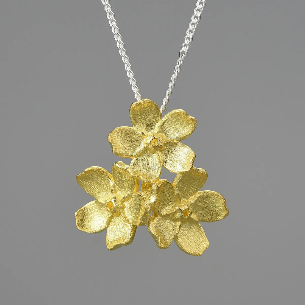 Sterling silver Myosotis Sylvatica flower pendant with electroplated gold or silver finish, pastoral style.