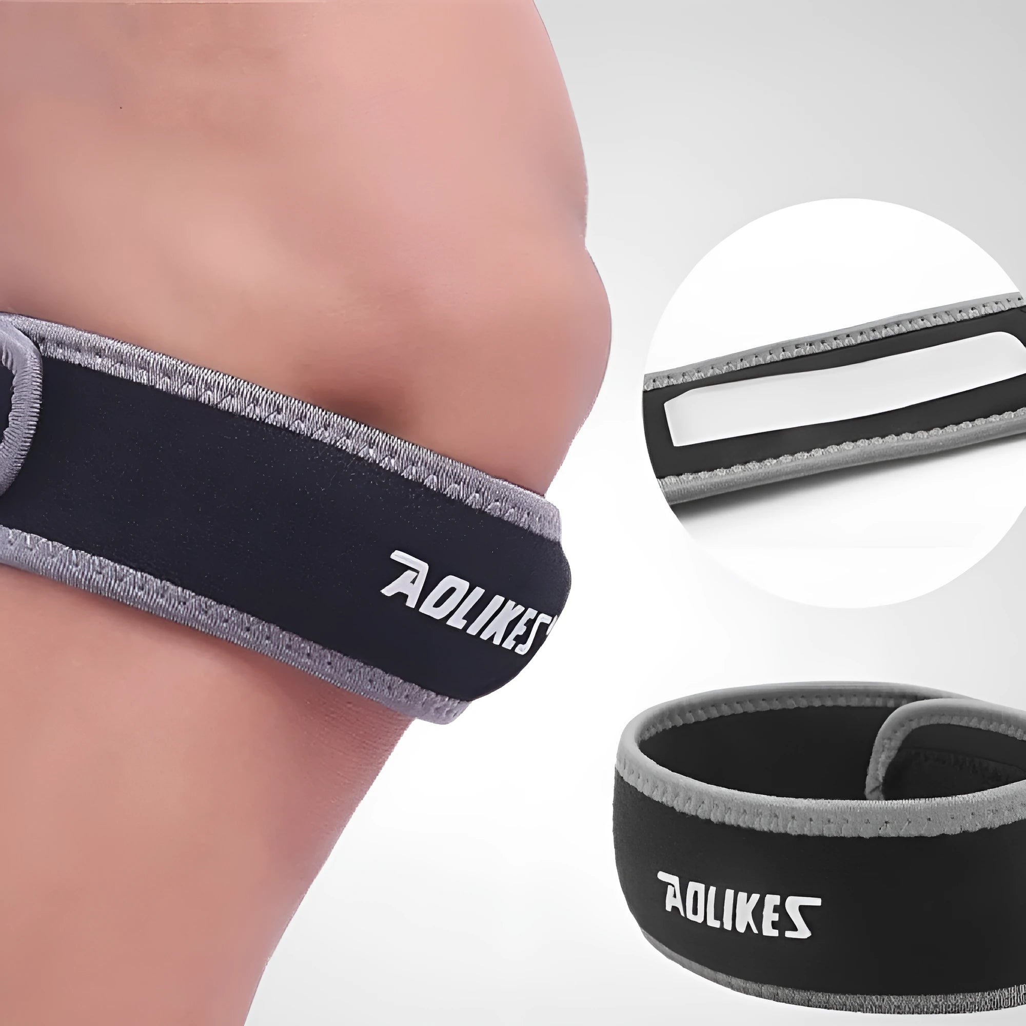 Black and grey patella retinaculum knee support for adult sports use.