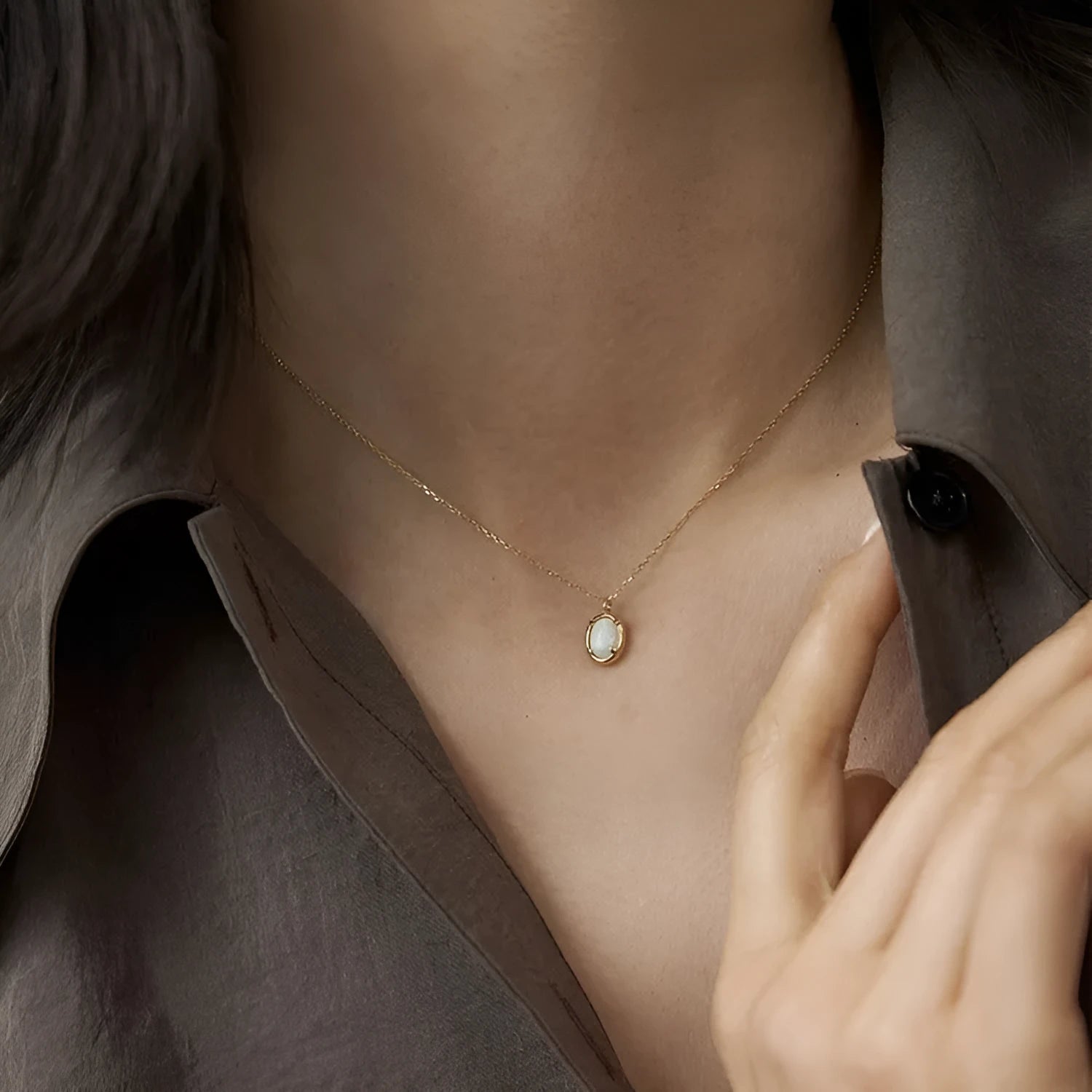 Jelly opal gemstone set in a geometric oval sterling silver pendant necklace.