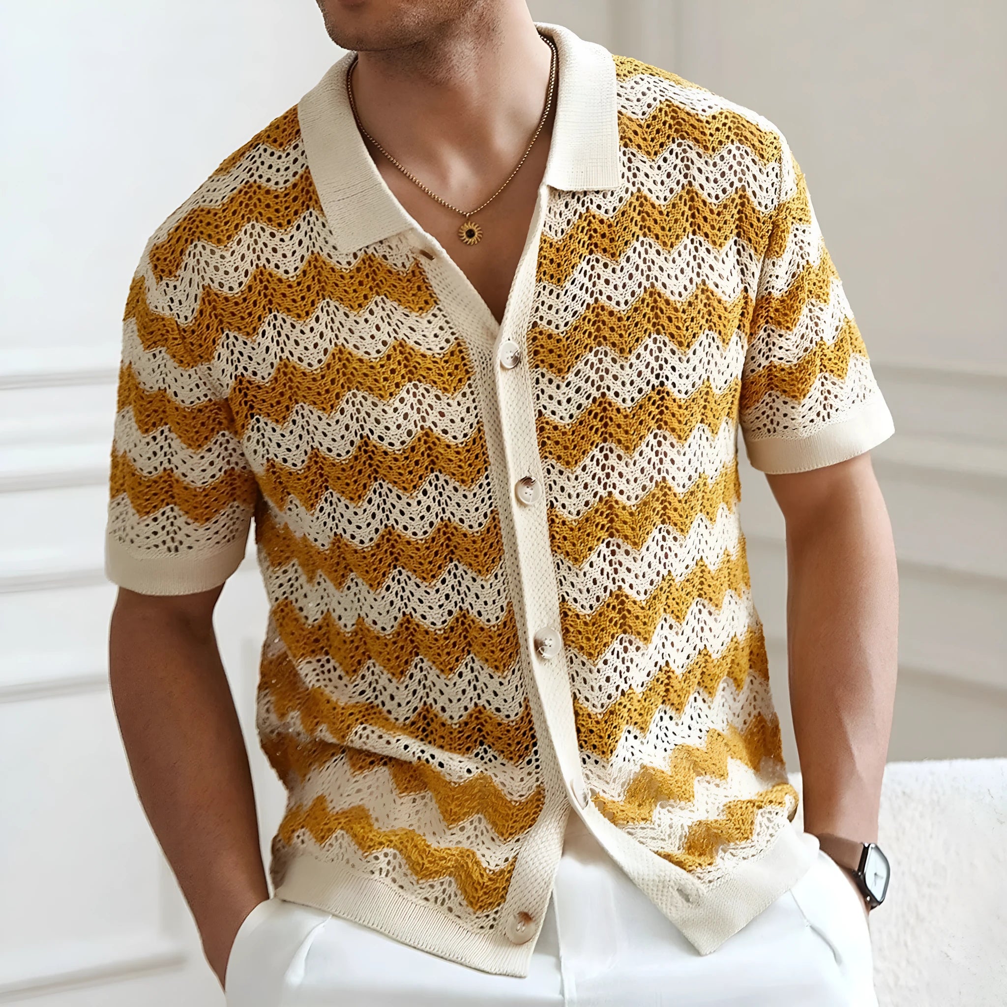 Yellow short sleeve sweater with hollow jacquard corrugated texture and flocking detailing on a hanger.