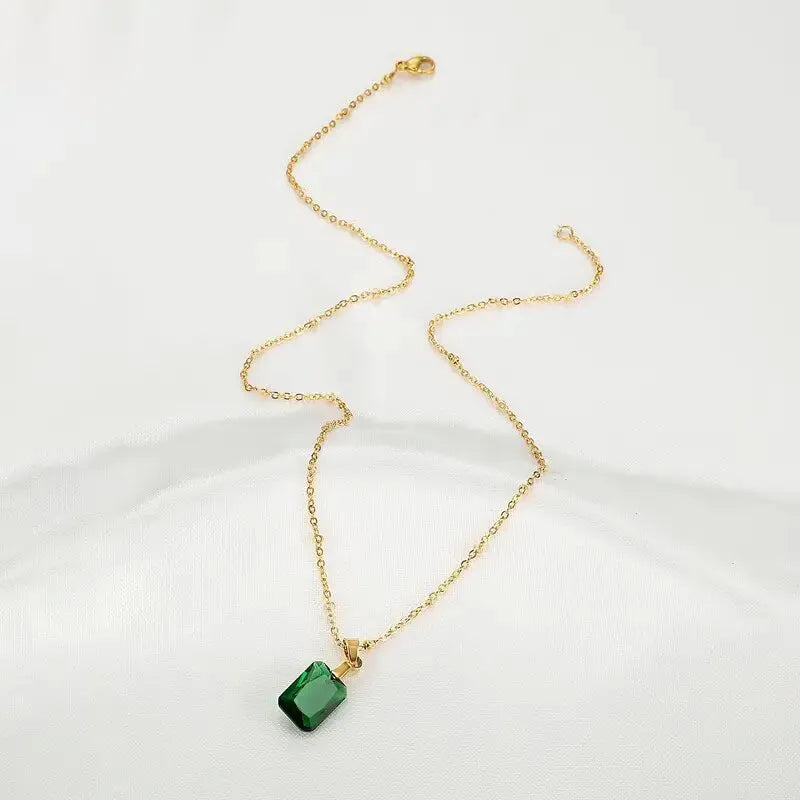 Copper rectangular geometric pendant necklace on O-ring chain in green colour.