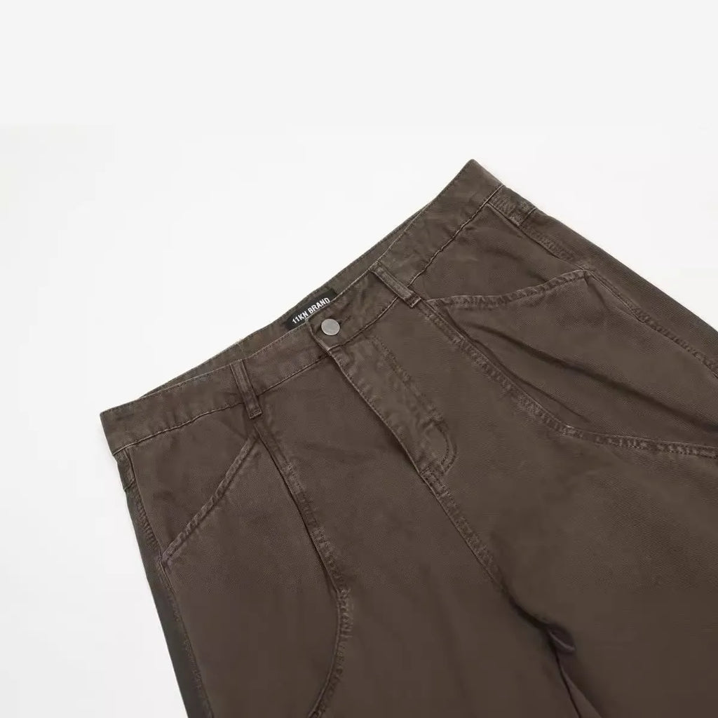 Men's loose straight-leg high-waist jeans in brown cotton fabric laid flat