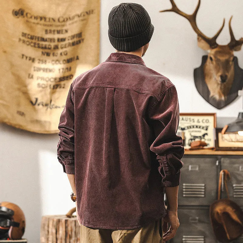 Men's black corduroy shirt jacket with long sleeves and loose retro fit shown unbuttoned