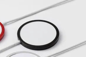 Metal magnetic wireless charger for iPhone 12 and 13 series in silver, black, blue, or red colours with USB cable