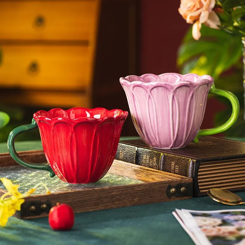 Ceramic breakfast cup with floral pastoral design showing red and purple colour options