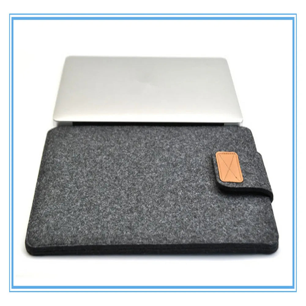 Dark grey felt clamshell laptop bag open to show internal compartment for a tablet