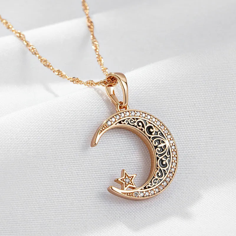 Rose gold star and moon pendant necklace with zircon stone on an adjustable water wave chain.