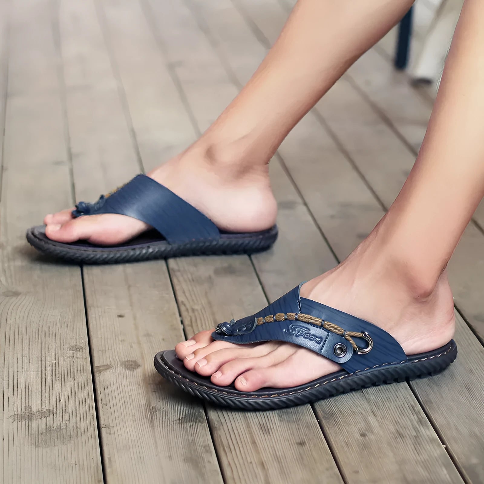 Men's casual non-slip slippers in blue with PU leather uppers, shown on a foot.