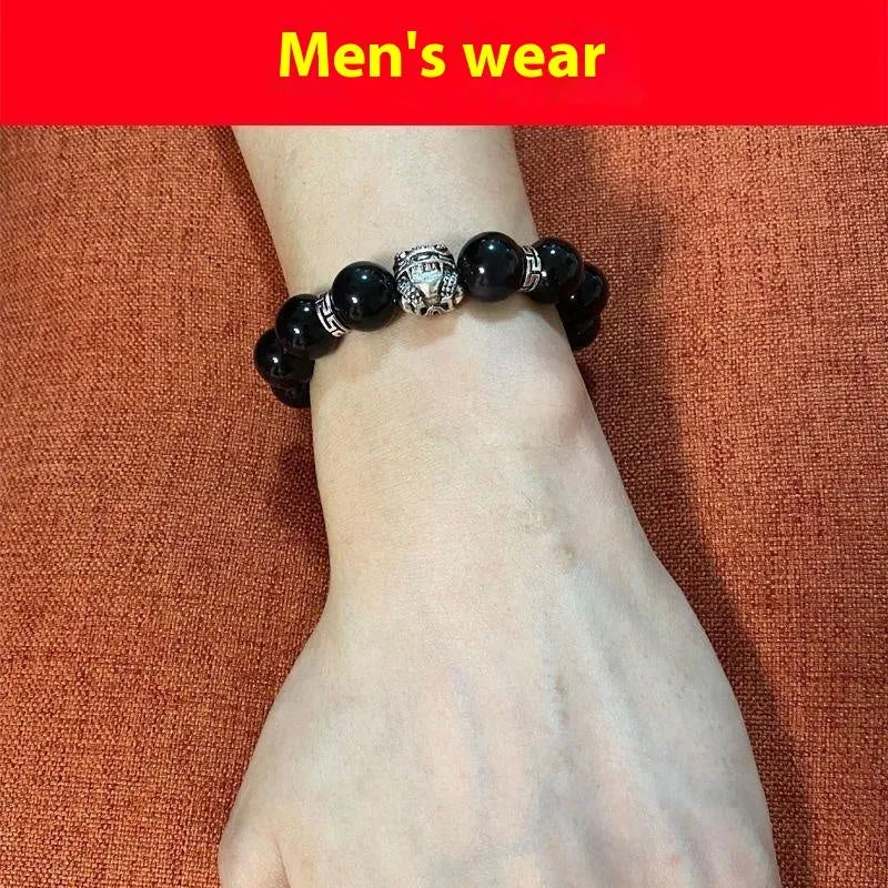 Silver 999 obsidian bracelet with lucky colour eye pattern showing male 12mm and female 10mm sizing options