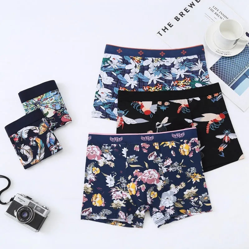 Men's floral print cotton boxer briefs on a white background, showing the U-shaped pouch design and mid-rise waistband.