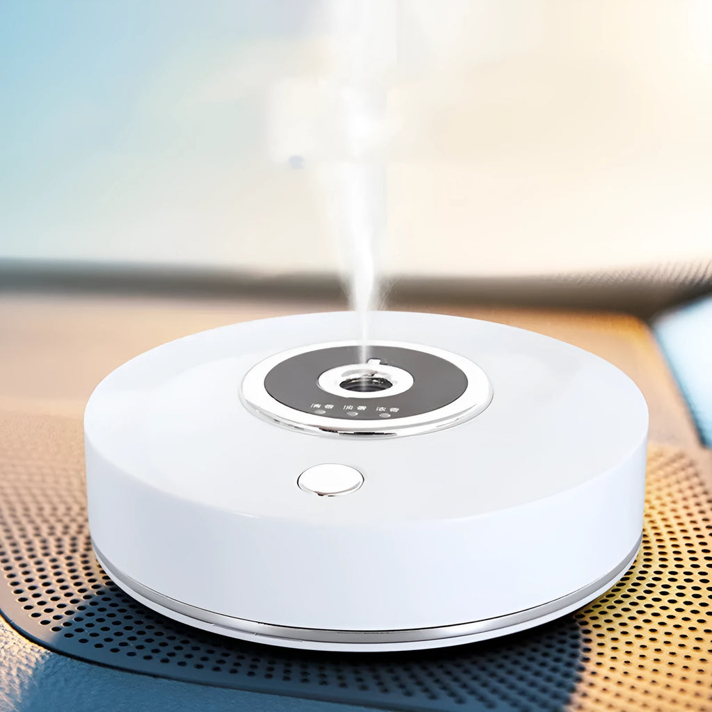USB-powered black car air freshener diffuser with charging cable and anti-slip pad on a car dashboard.