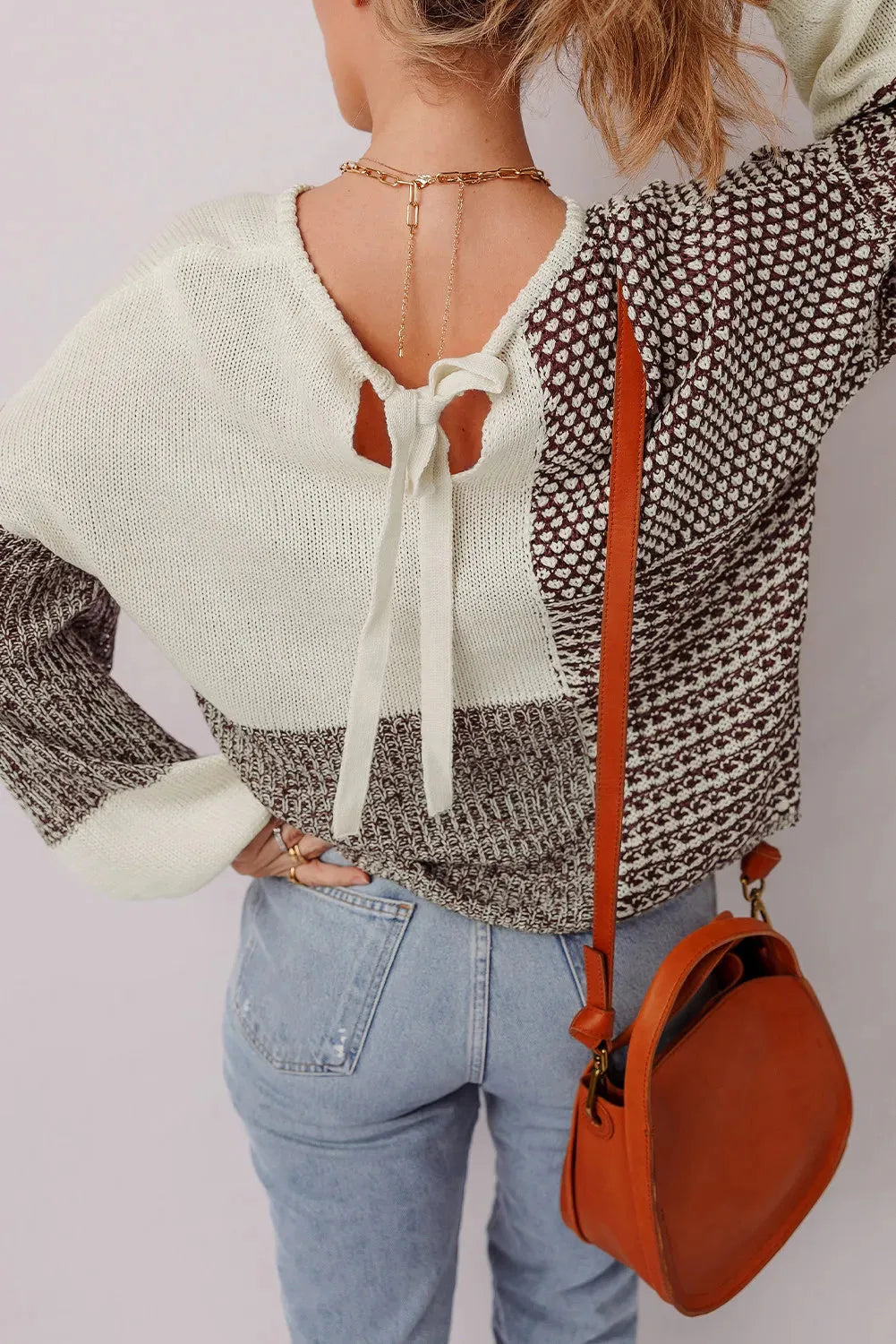Dark khaki colour block women's loose knit sweater with drop shoulders and a back tie fastening.