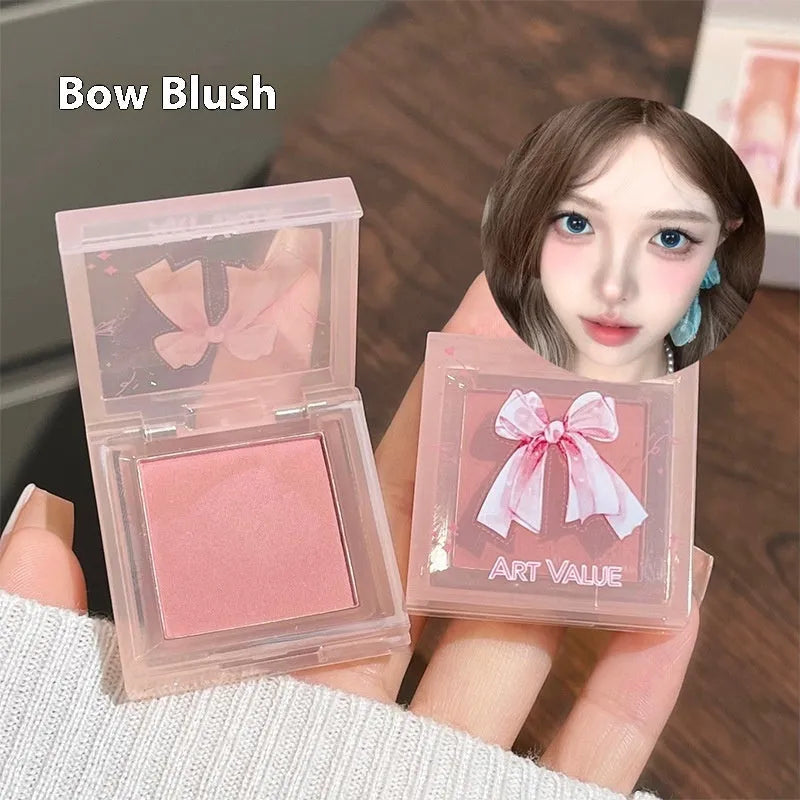 Butterfly Box makeup set containing four pink matte lip muds, one powder blusher, and a butterfly necklace in standard packaging.