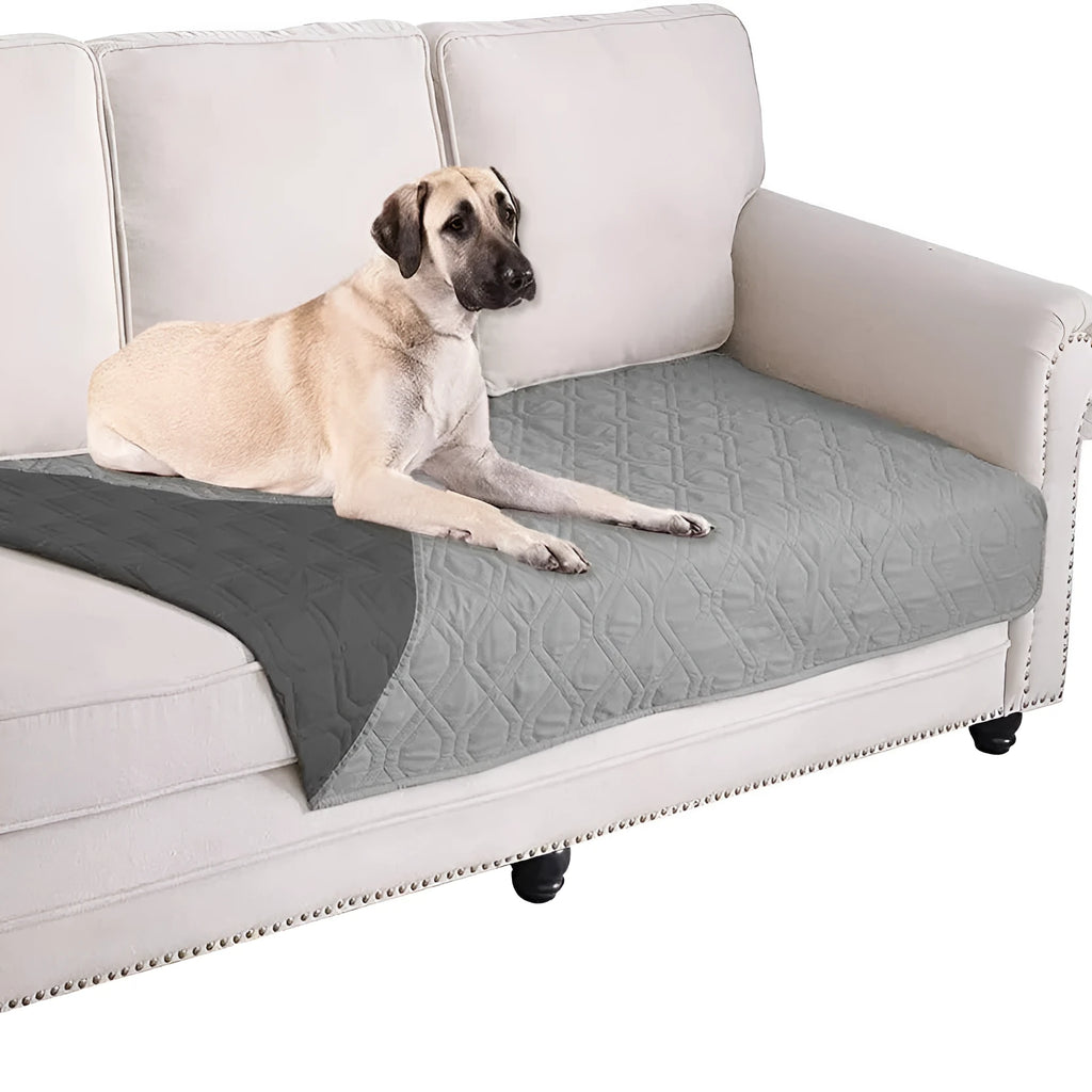 Reversible waterproof dog blanket sofa cover in burgundy and grey, laid flat on a sofa.