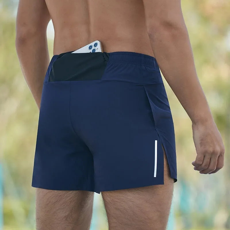 Men's red off-road running shorts with a high waist and loose fit, shown for athletic use.