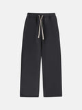 Men's black fleece-lined sweatpants with elastic drawstring waist in loose fit trousers style
