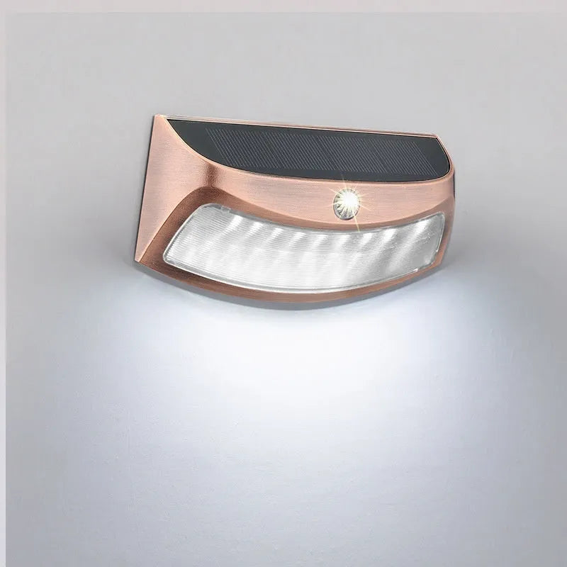 Solar outdoor wall lamp with smiling face design for garden courtyard lighting