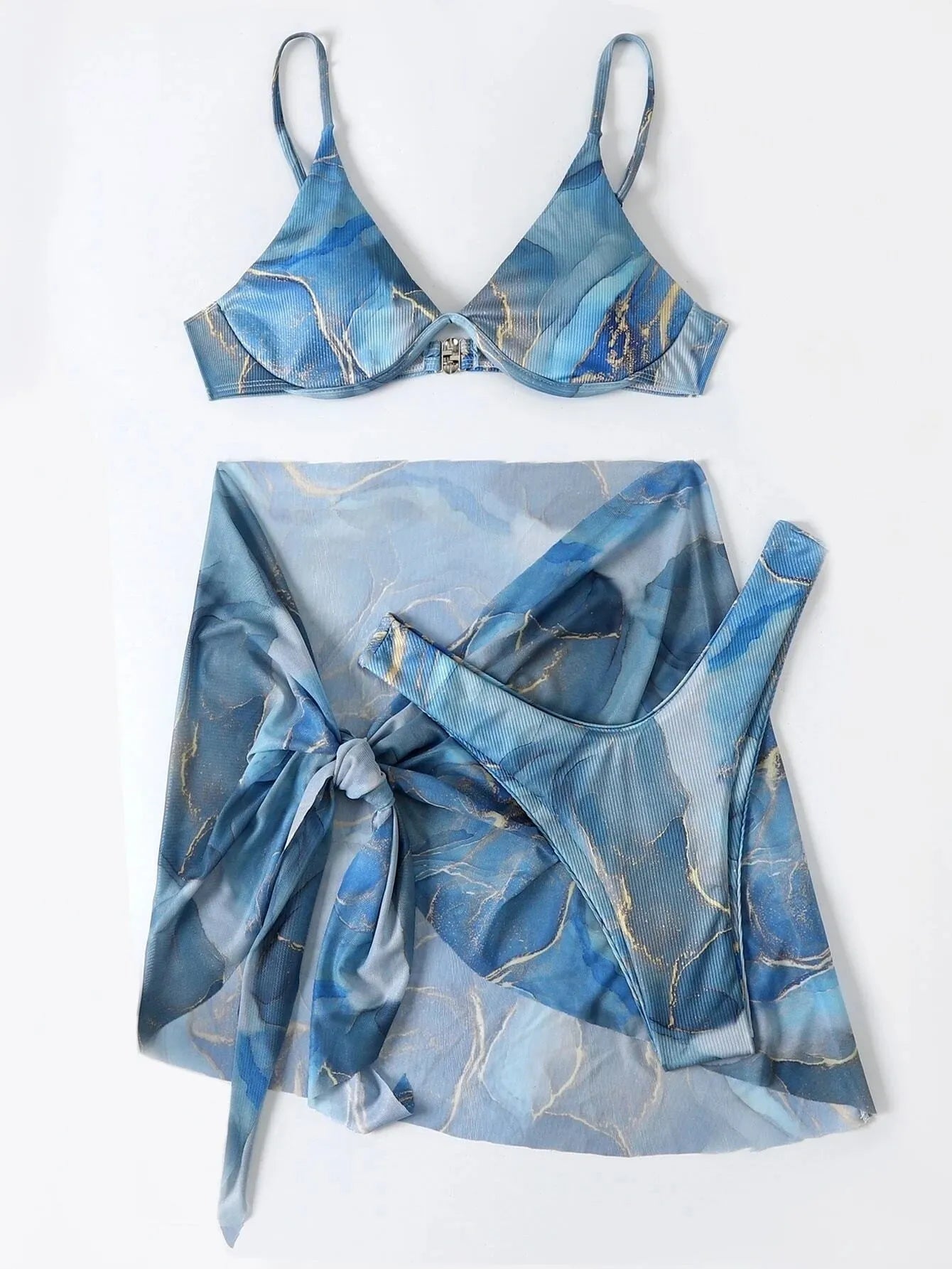 Three-piece marble print bikini swimwear set showing bra, briefs and skirt in blue colour
