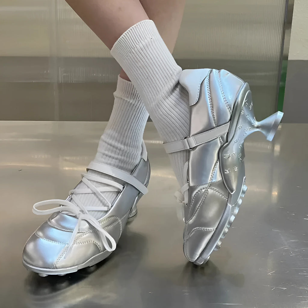 Women's silver sports shoes with lace-up front and decorative bow detail on microfiber upper