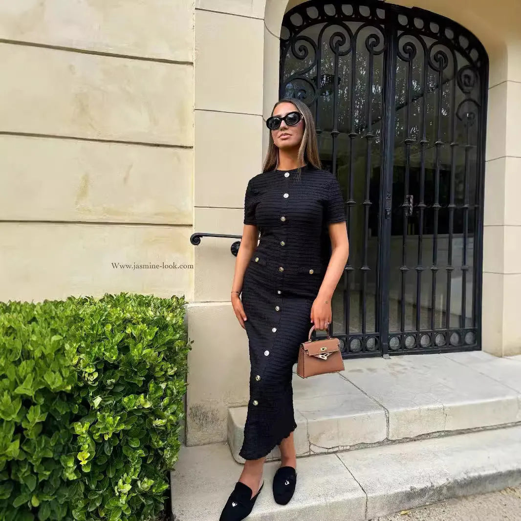 French retro slim fit knitted long-sleeved dress in black with button detail.