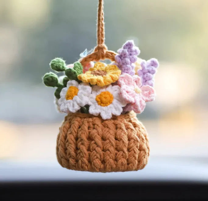 Green and white knitted wool car plant decoration with plastic base and hanging rope