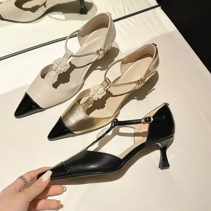 Women's gold stiletto heels with flower decoration, pointed toe, and shallow mouth cut on a beef tendon sole.
