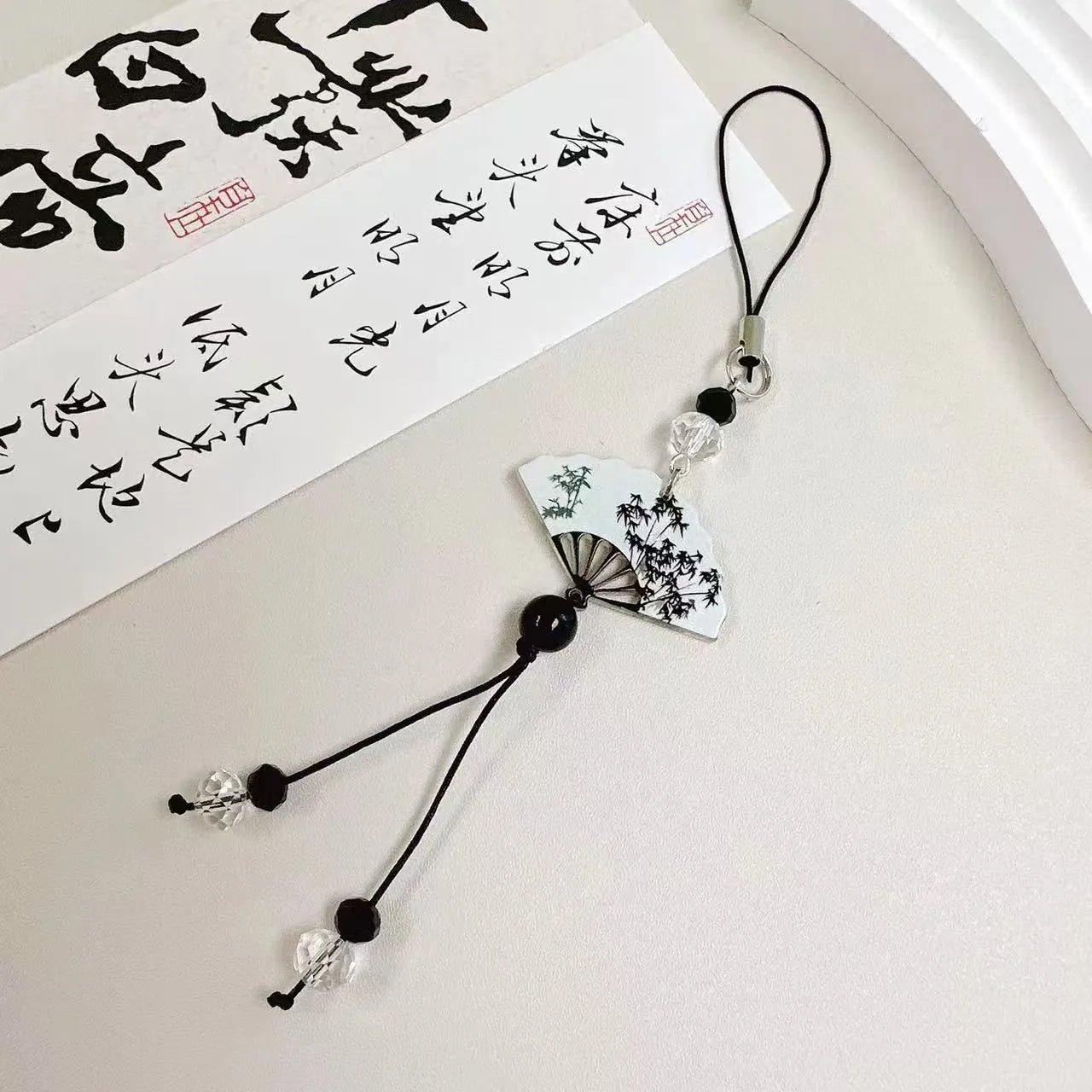 Guofeng style bead pendant keychain with plants and flowers pattern in baked varnish finish.