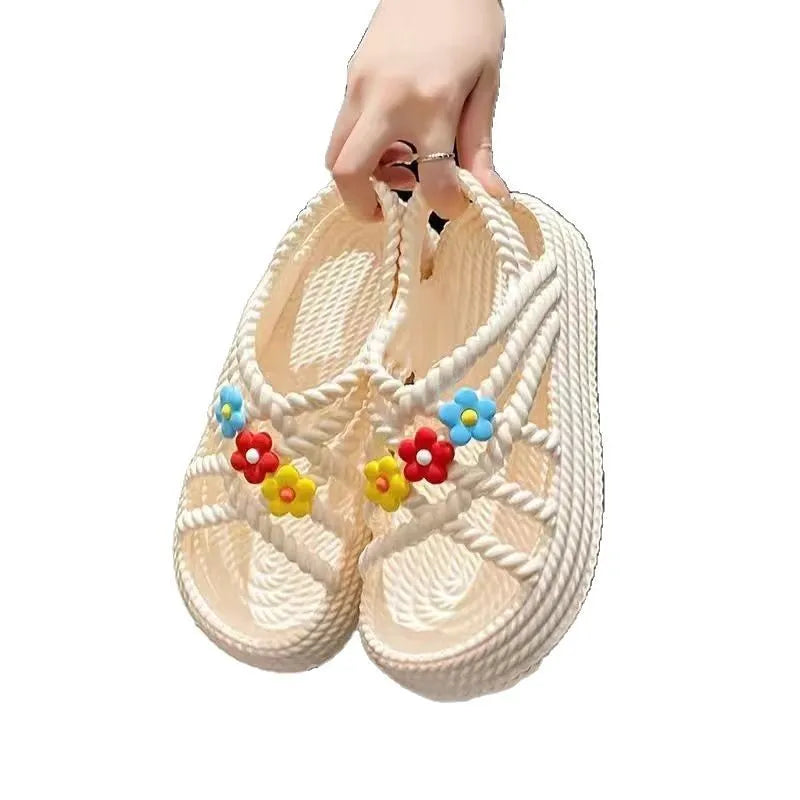 PVC round-toe sandals with non-slip soles and floral decoration in beige and black colour options
