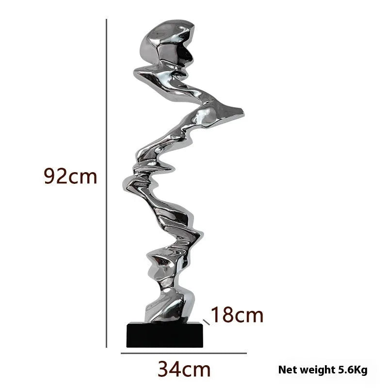 Abstract still life decorative sculpture in natural resin with metallic finish