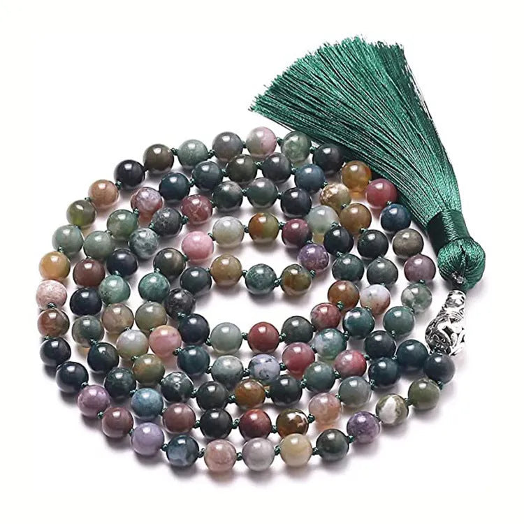 Long beaded agate necklace with geometric stones and a tassel, showing colourful variations.