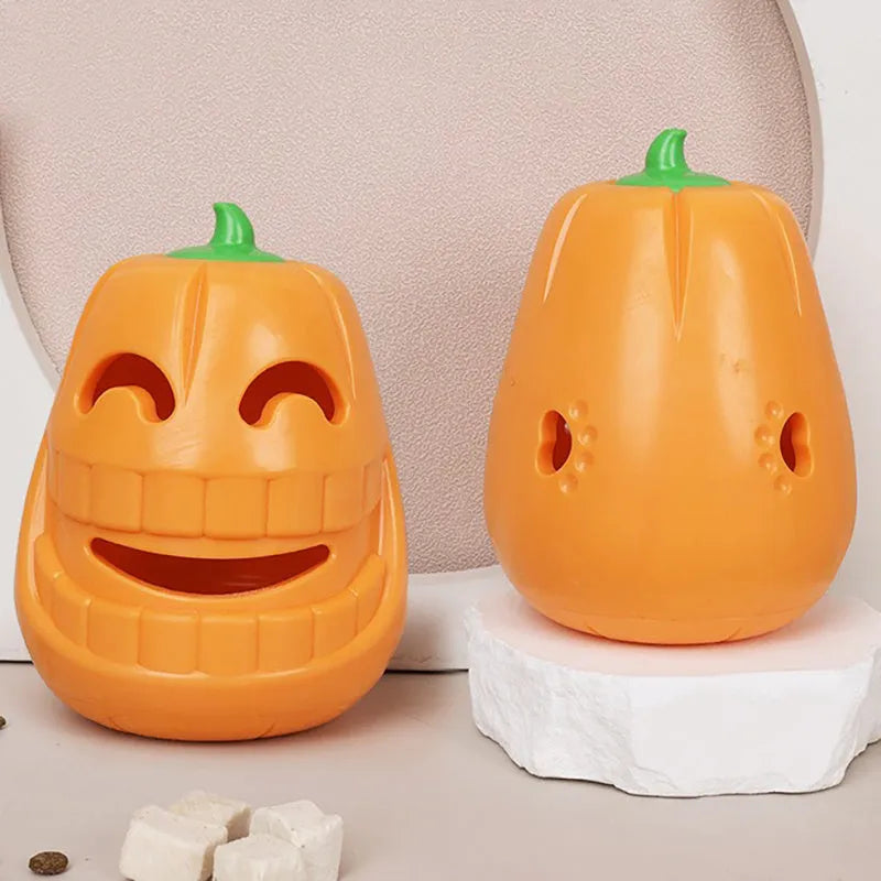 Orange Halloween pumpkin shaped interactive dog chew toy made of thermoplastic rubber with treat dispensing funnel design for all breed sizes