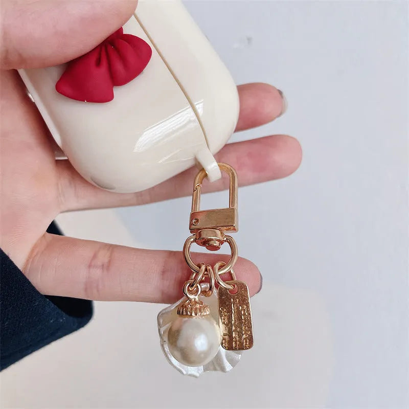Beige red bow shell TPU protective case with clamshell closure for AirPods Pro wireless earphones