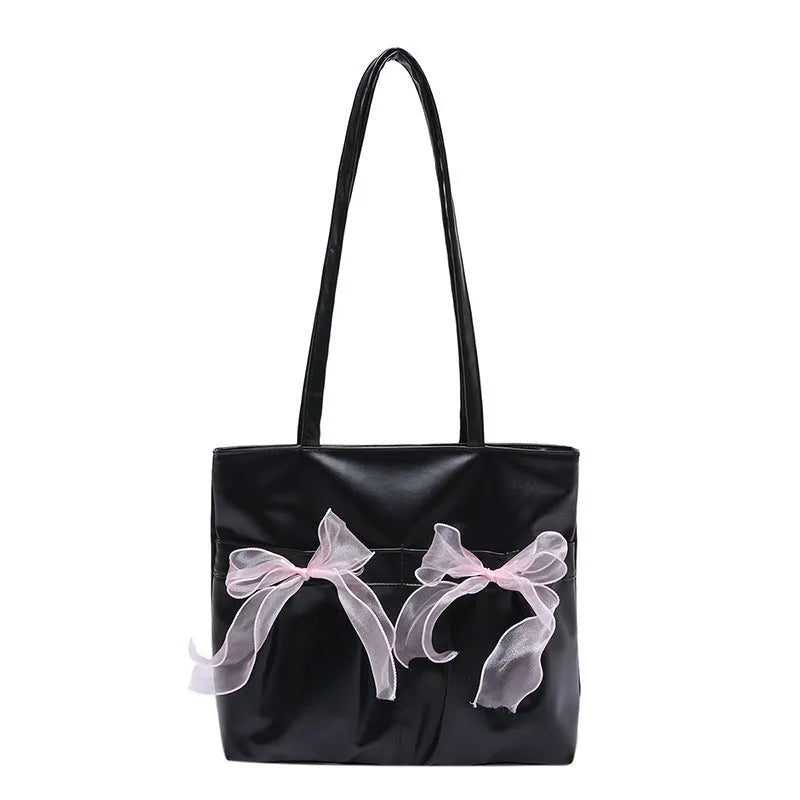 Black college style bow tote bag with double shoulder straps and large main compartment